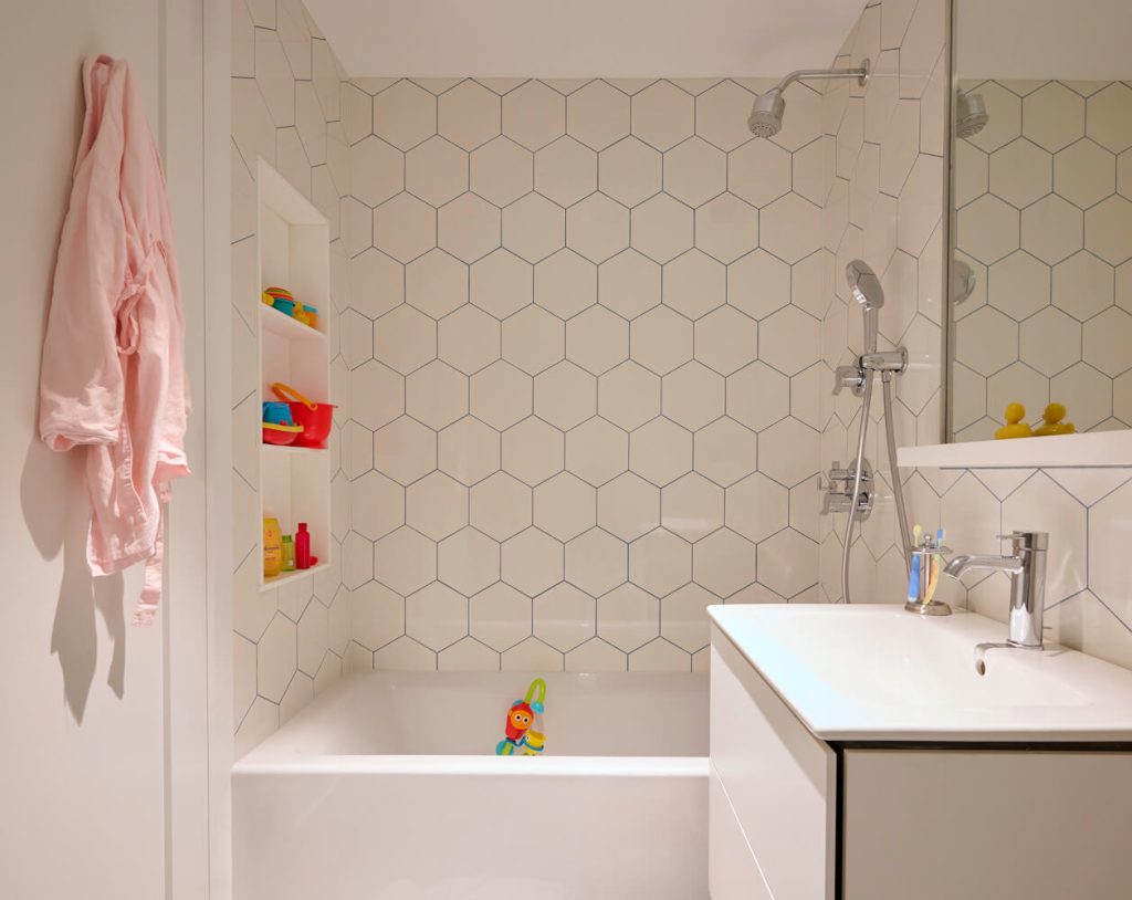 Upper West Side, Duplex, Bathroom with hexagon white tile by Delson or Sherman Architects PC
